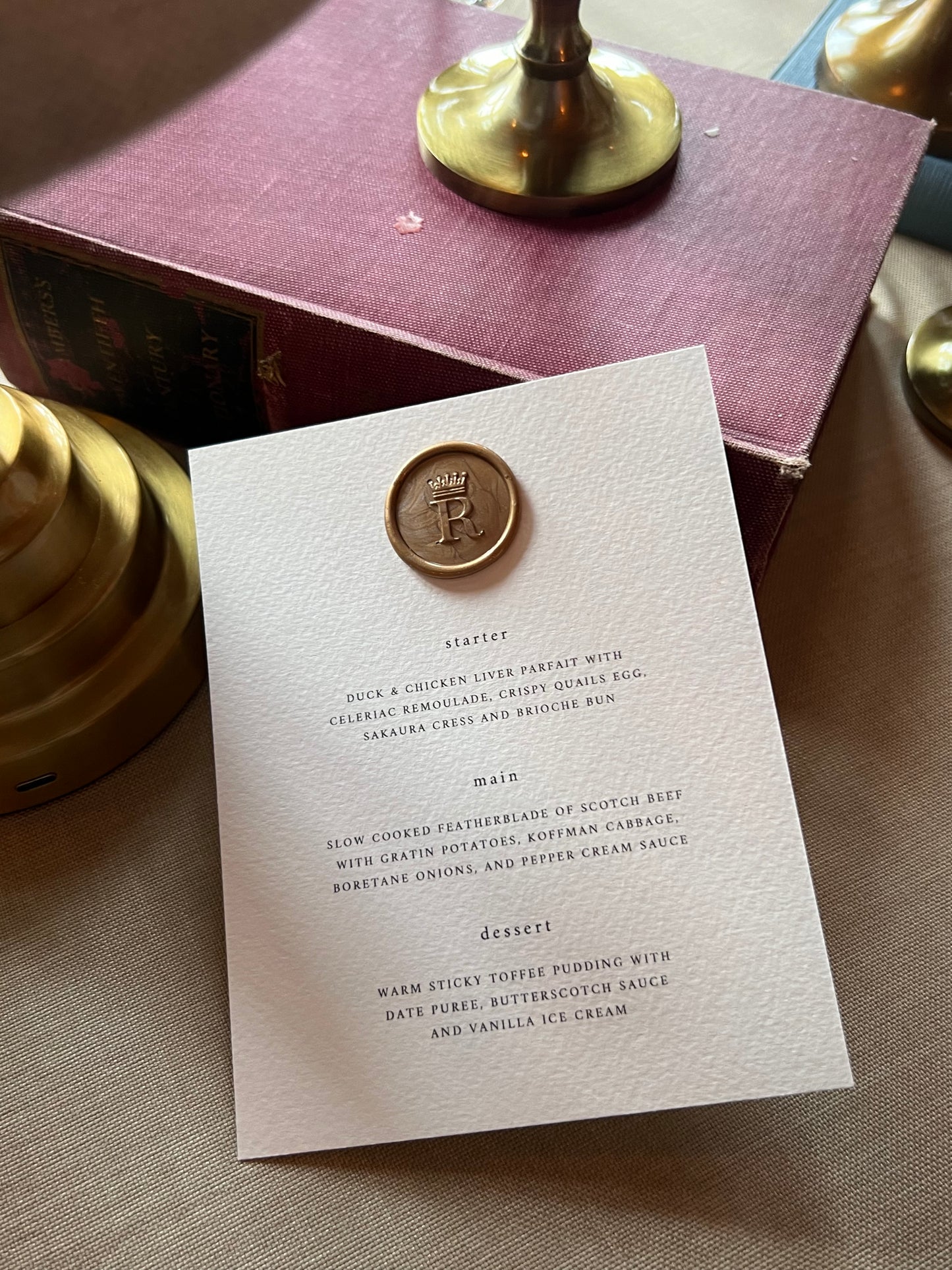 Gold Wax Seal on a menu