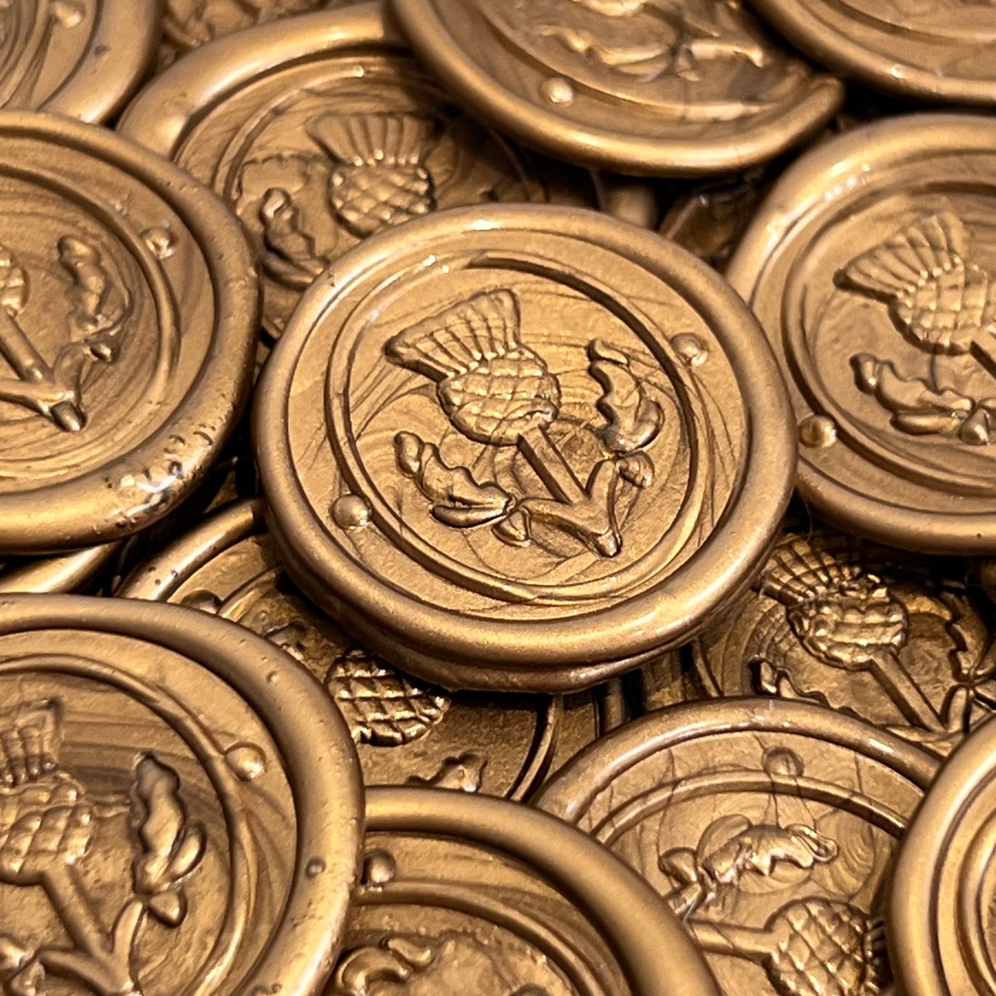 Thistle wax seal in gold
