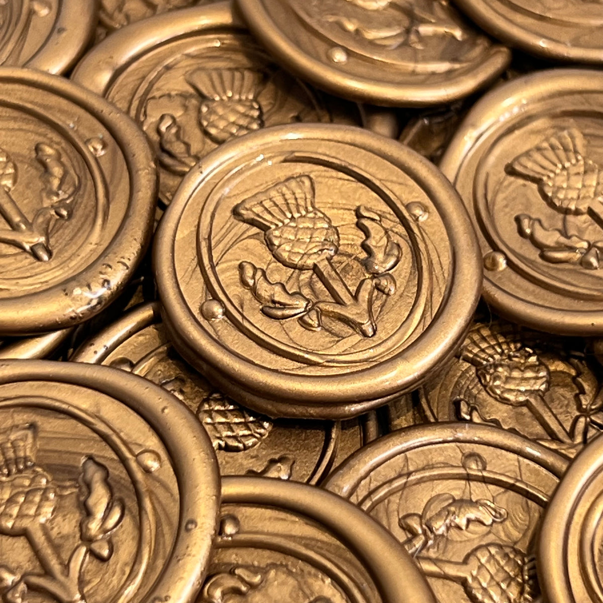Thistle wax seal in gold