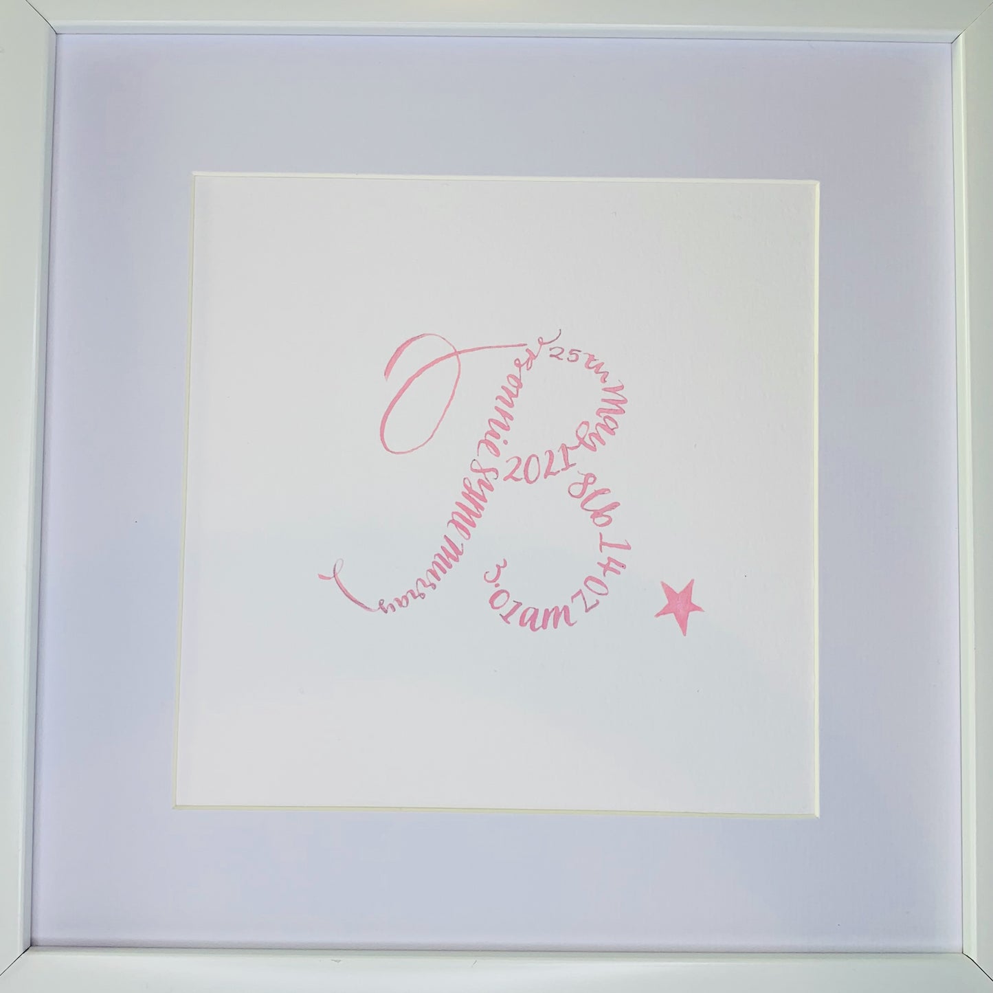 close up of white mount and calligraphy B made up with calligraphy words baby name, date of birth and weight, Finished with pink star to bottom right 