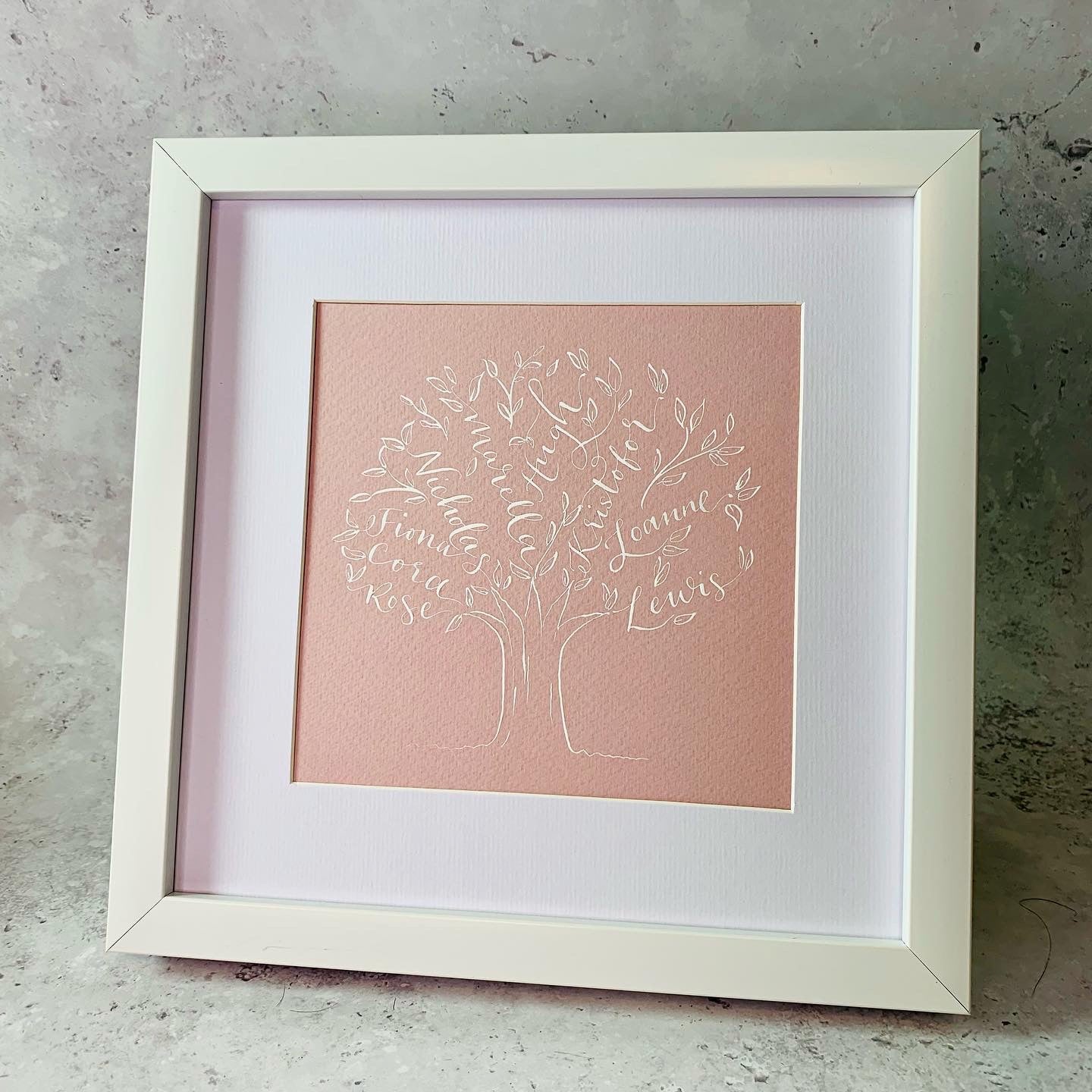 beautiful calligraphy family tree dusty pink card with white ink, white mount and white square frame. Family bespoke gift