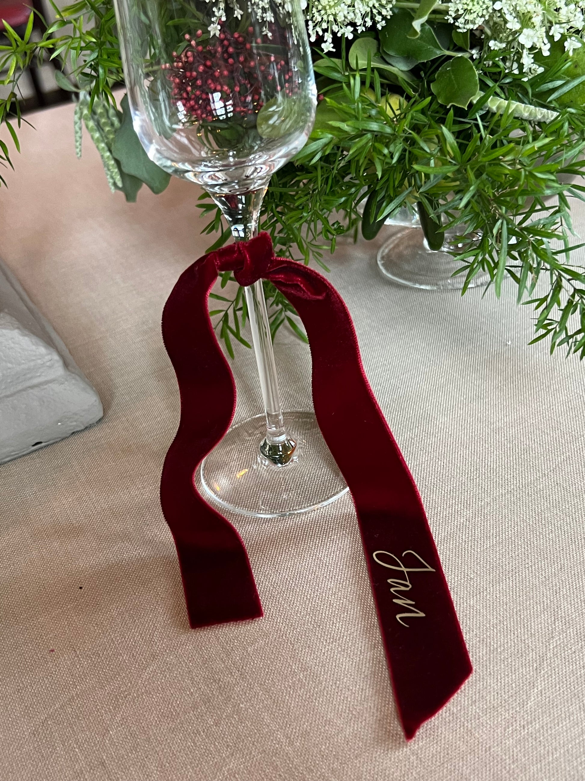 Burgundy Velvet ribbon name place on a glass

