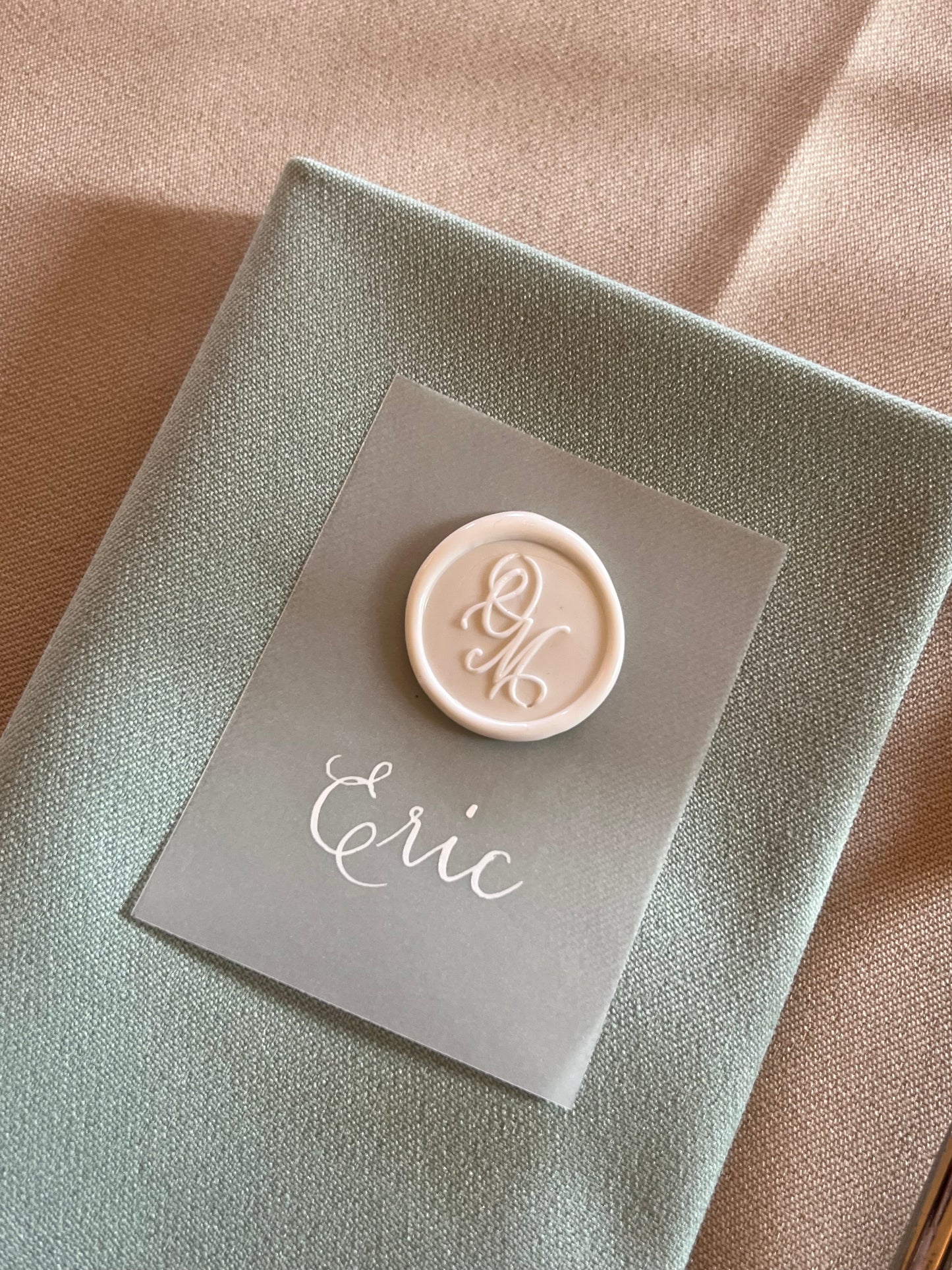 Personalised wax weal on a name place setting
