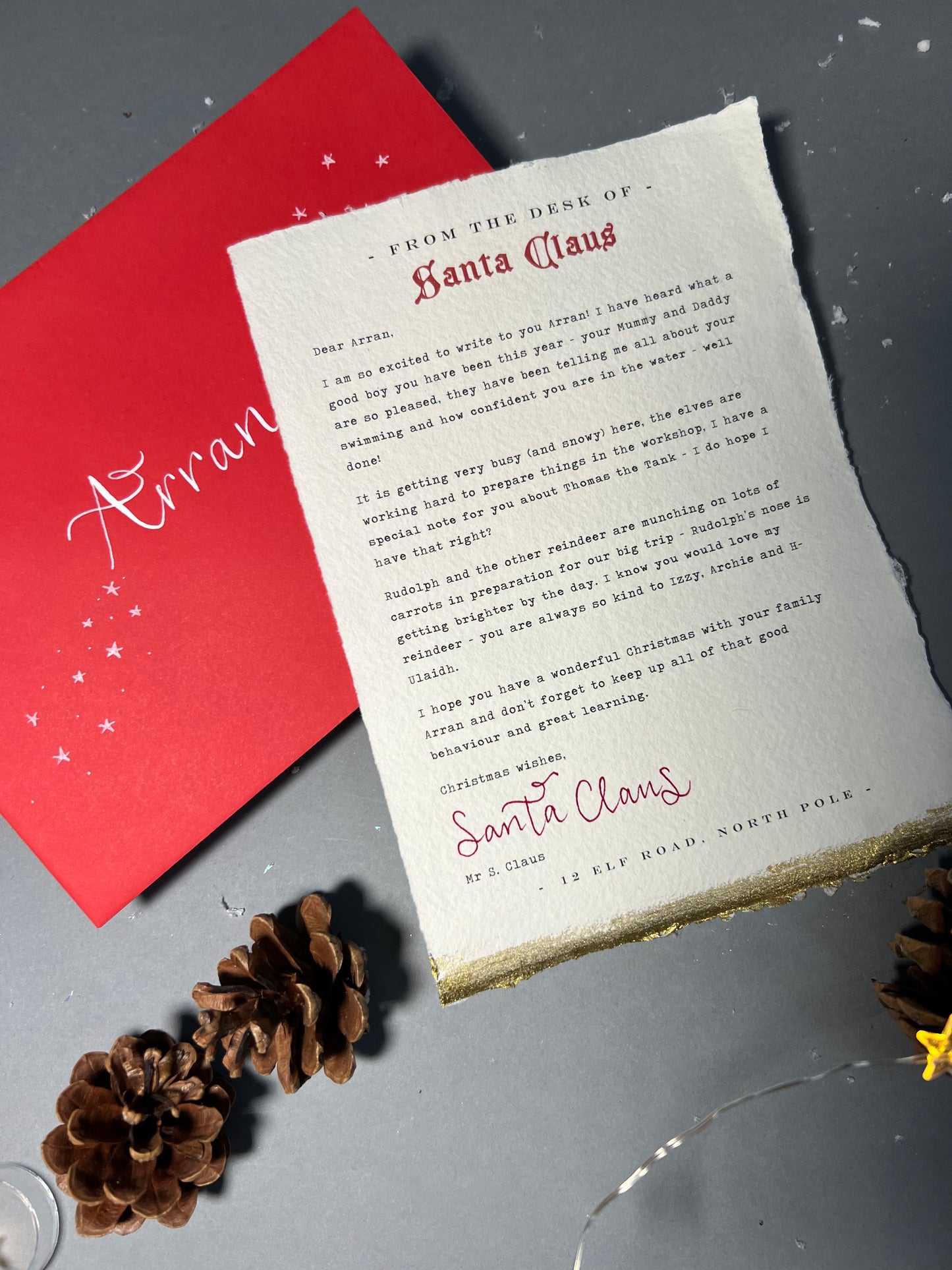 Stunning personalised letter from Santa, on handmade cotton paper with gold touches to bottom edge, red envelope with calligraphy name 