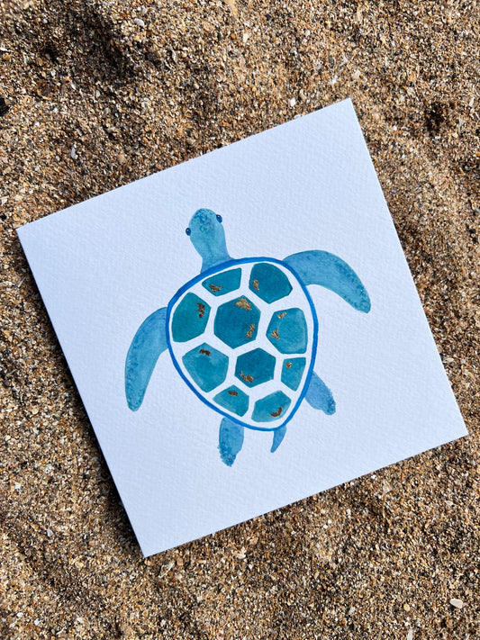 square greetings card on sand - blue sea turtle 