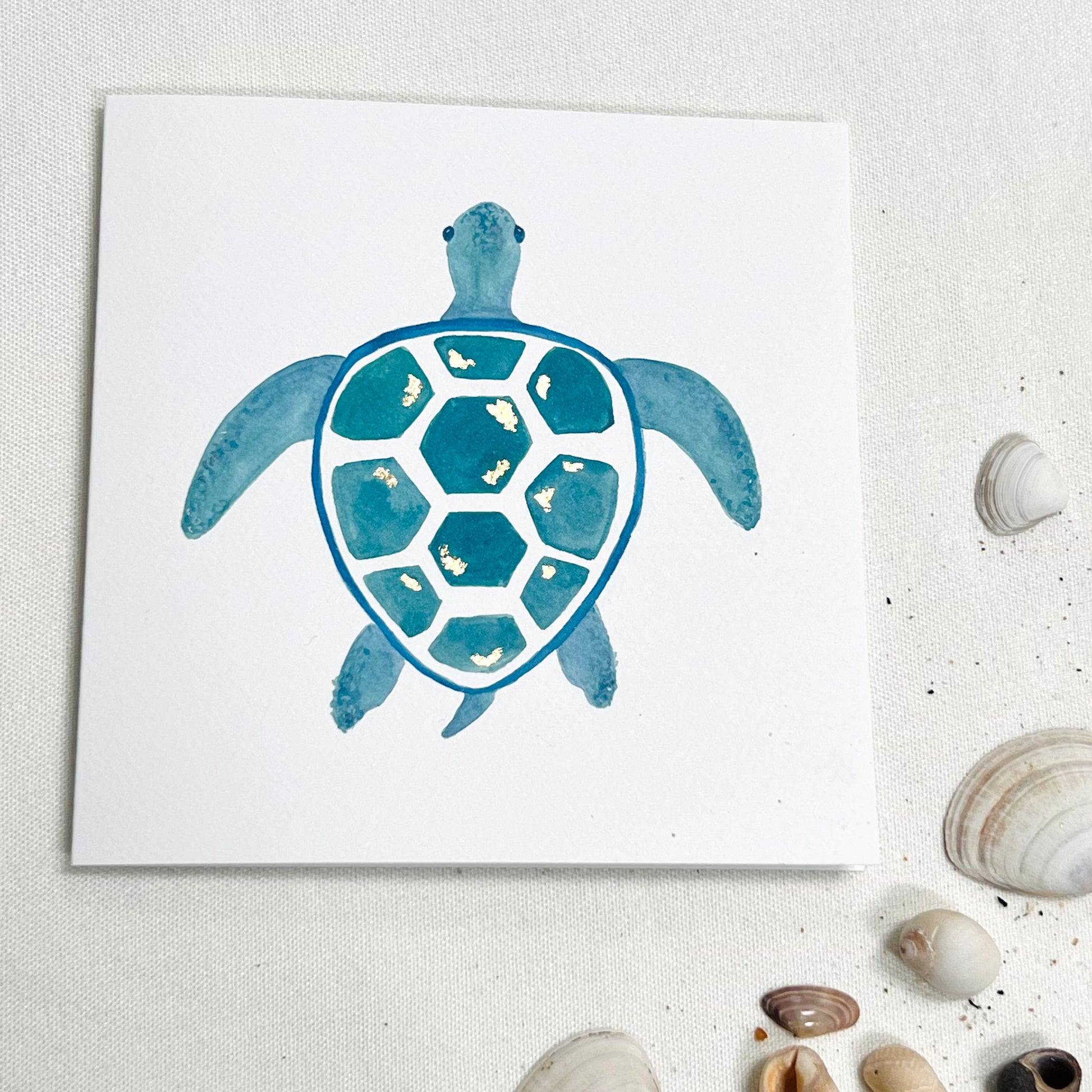 sea turtle card in blue watercolours with gold leaf details