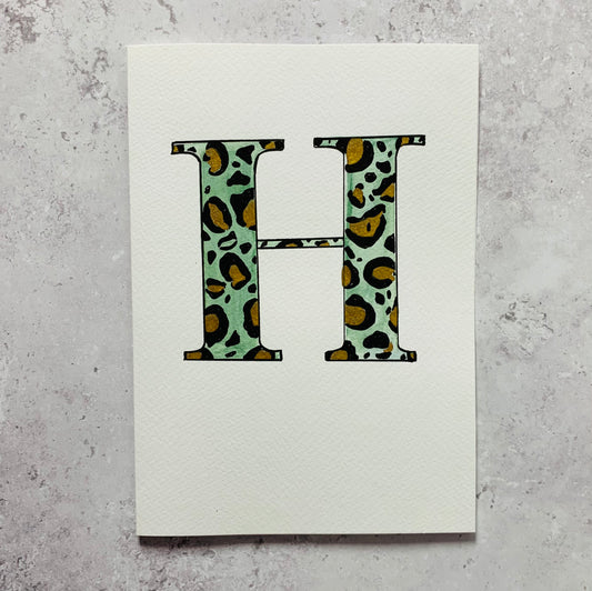 Hand painted initial with leopard print design