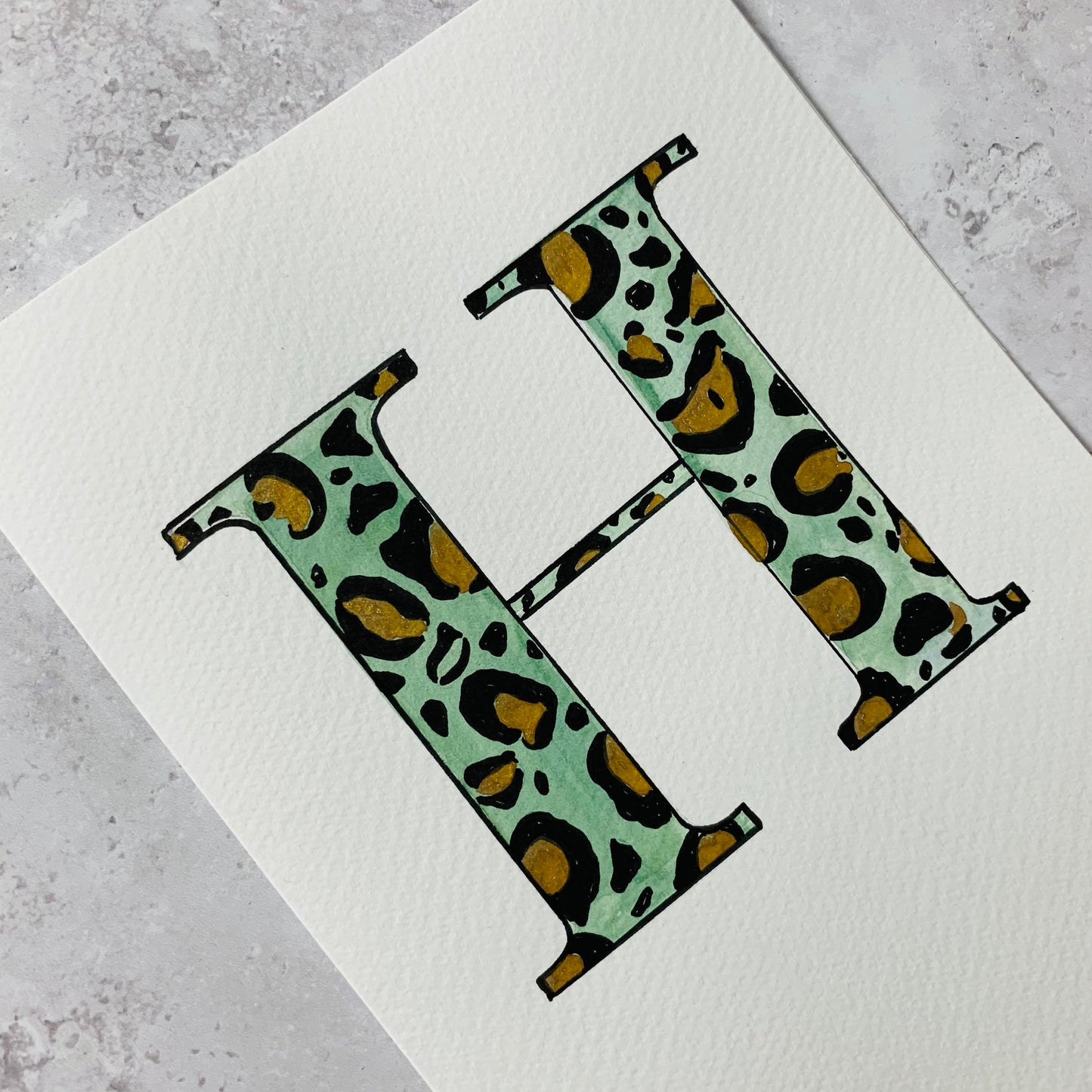 Hand painted initial with leopard print design