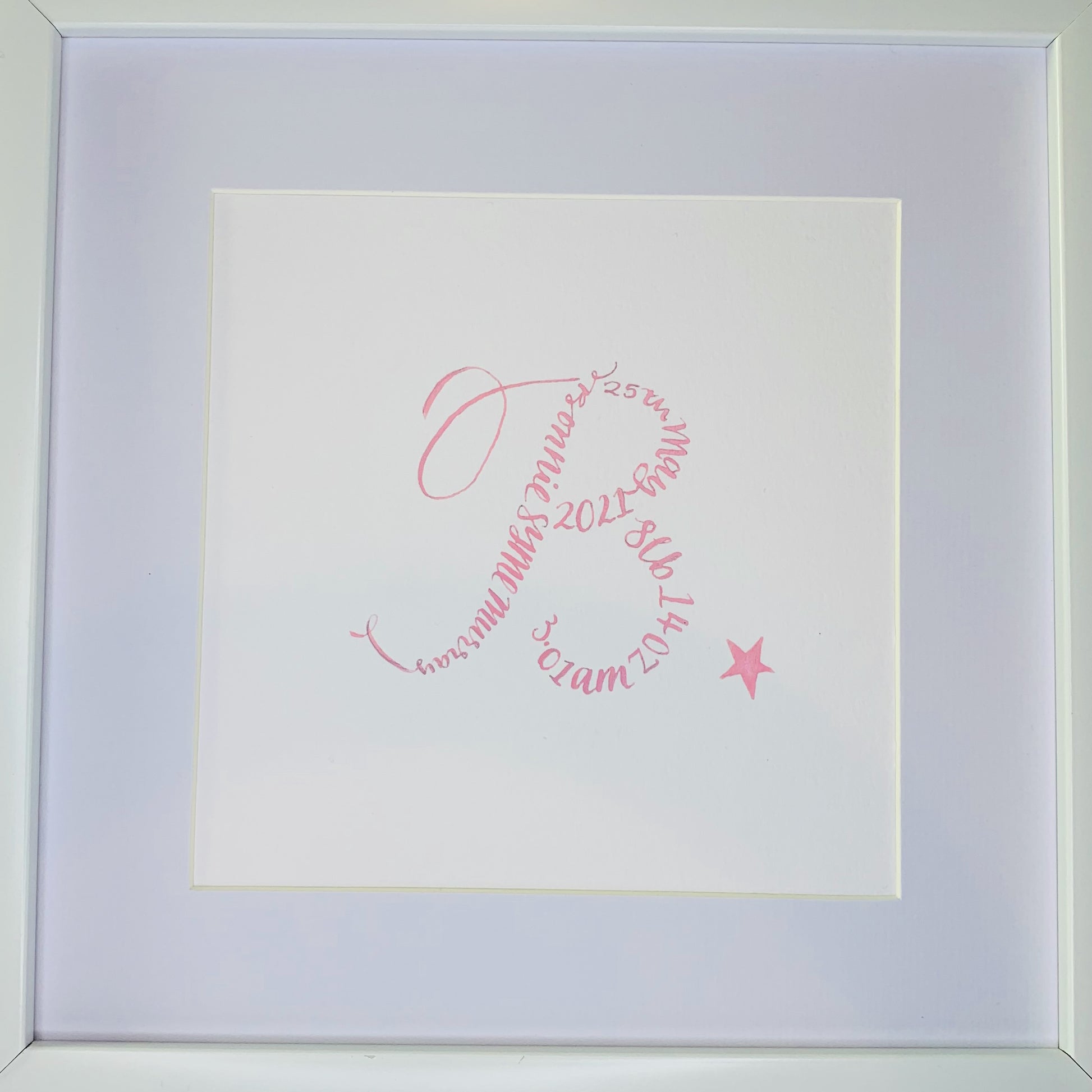 close up of white mount and calligraphy B made up with calligraphy words baby name, date of birth and weight, Finished with pink star to bottom right 