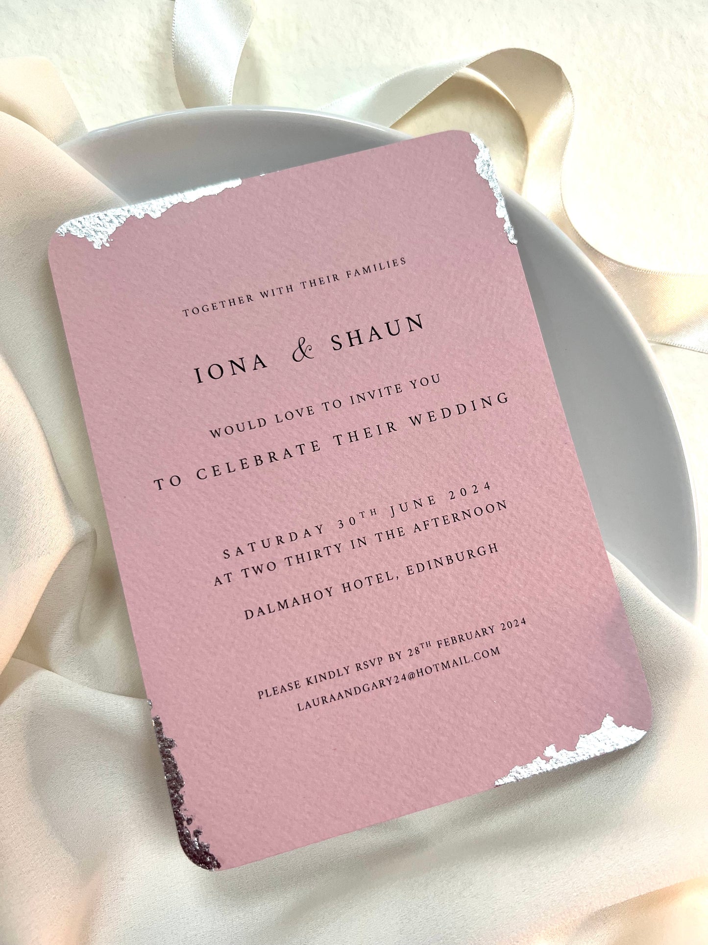 dusty pink invite with rounded edges and silver foil detail