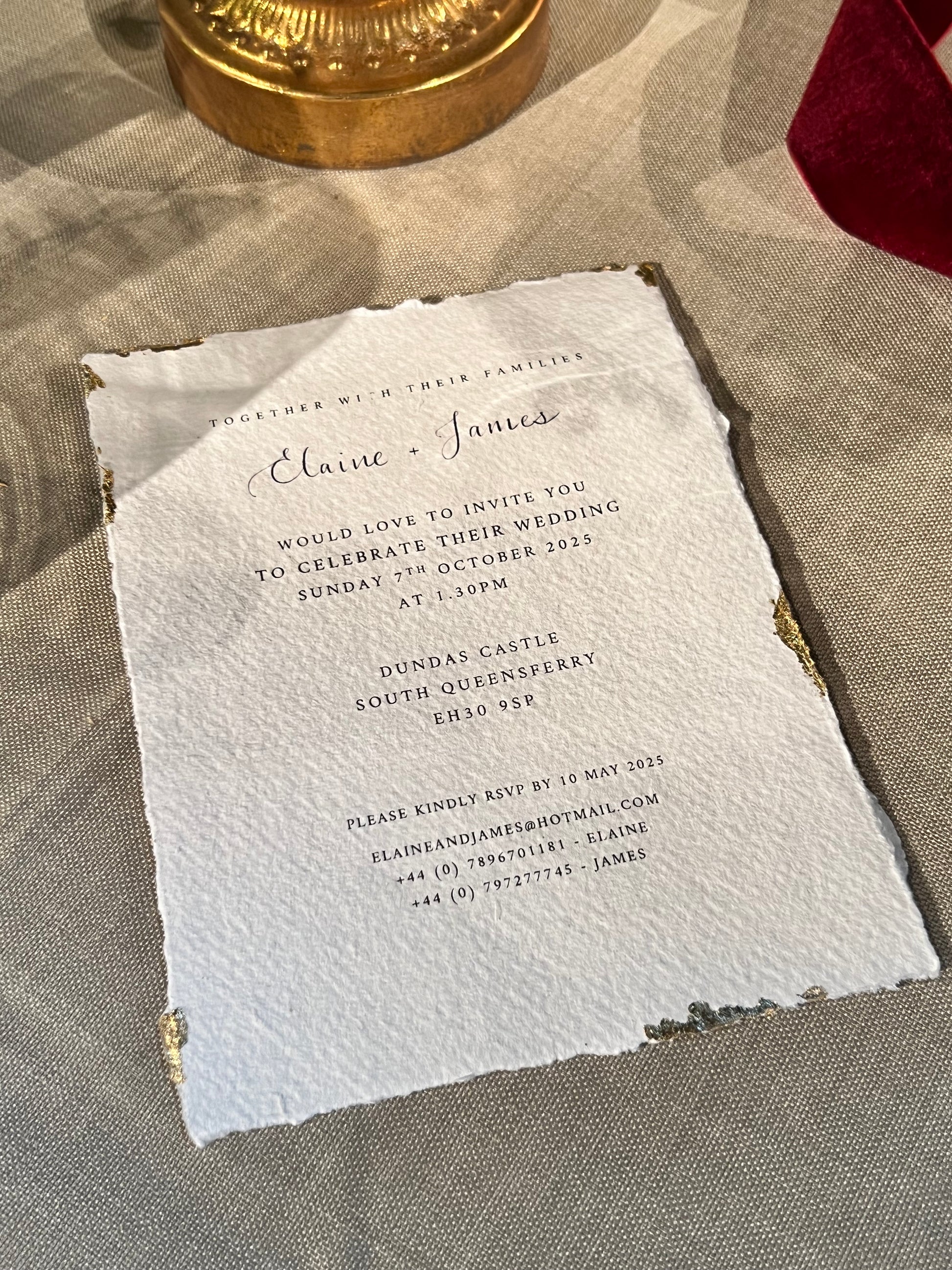 gold edged invitation on textured handmade cotton paper, elegant print with touch of calligraphy. 