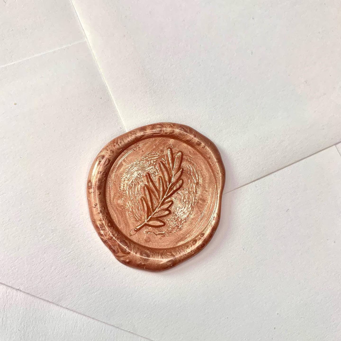 copper rose gold wax seal with foliage design