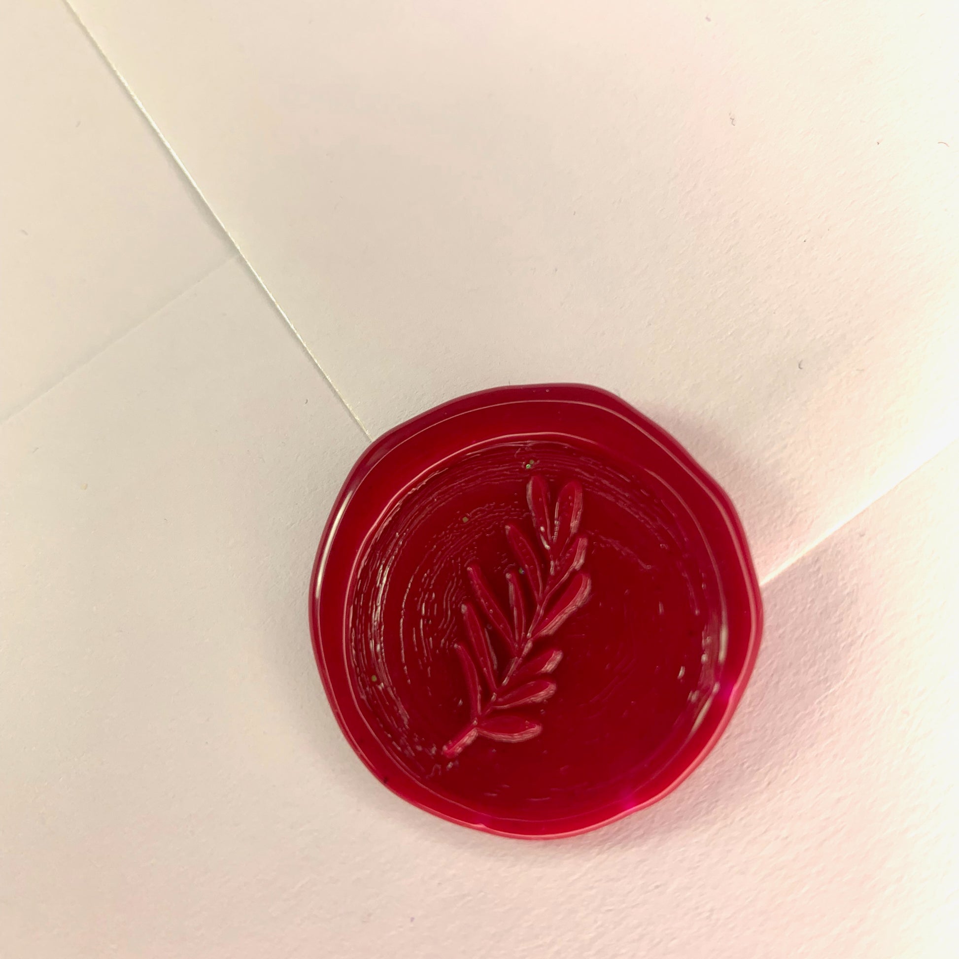 deep wine colour wax seal with foliage design