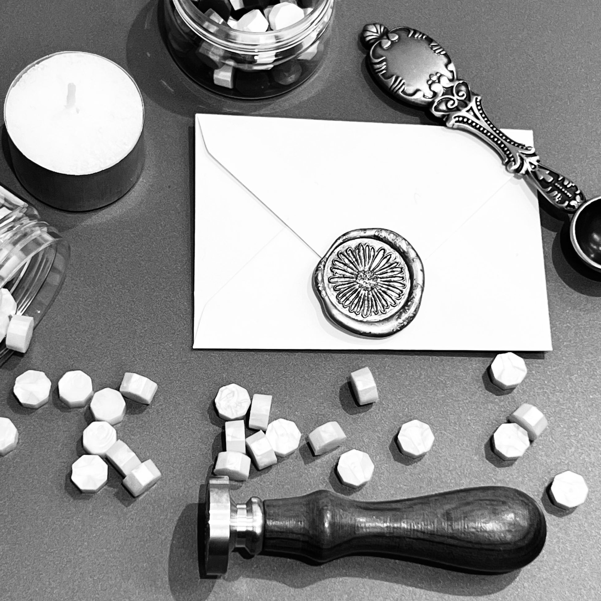 black and white picture of wax seal set contents